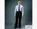 Full-length studio portrait of a male ballroom dancer wearing black Chrisanne Clover practice trousers, a white long-sleeve dance shirt, and a black tie against a grey backdrop.