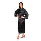 Length view of the International Dance Shoes Adult black kimono showing the flowing hem and professional ballroom shoes.