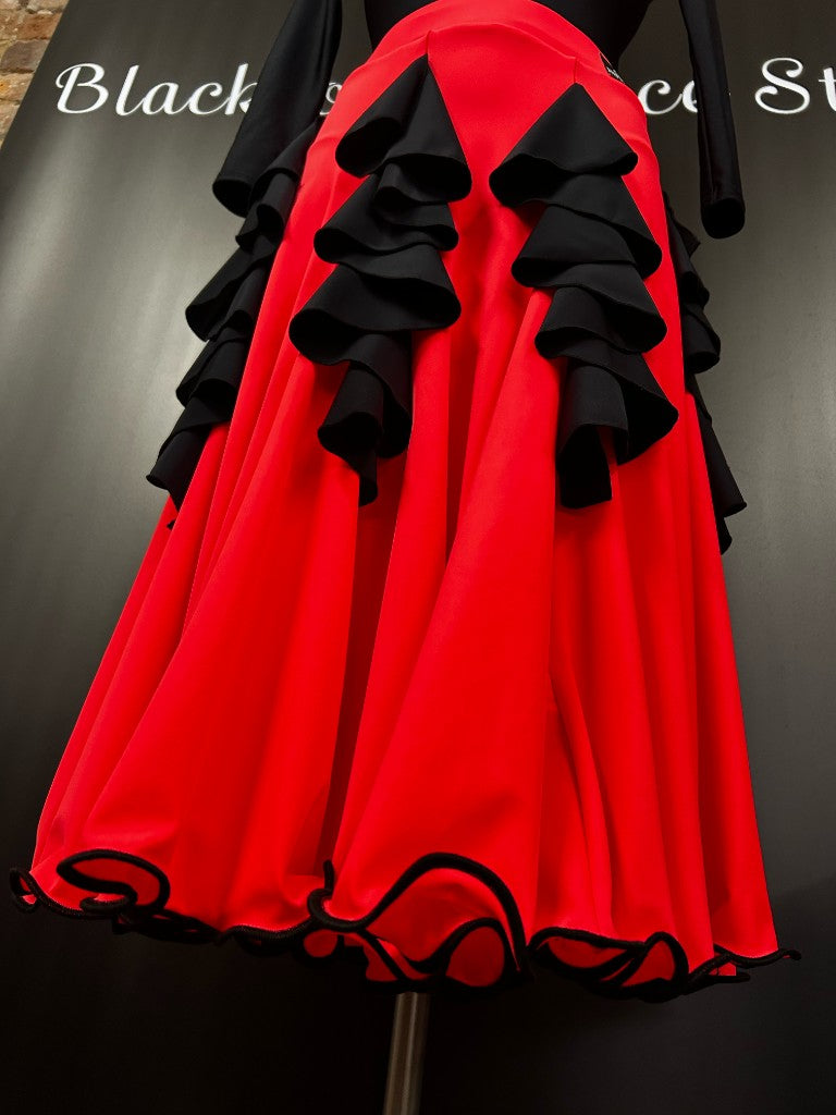 Flavia Dance Skirt — red panels with black cascade flounces and corded hem