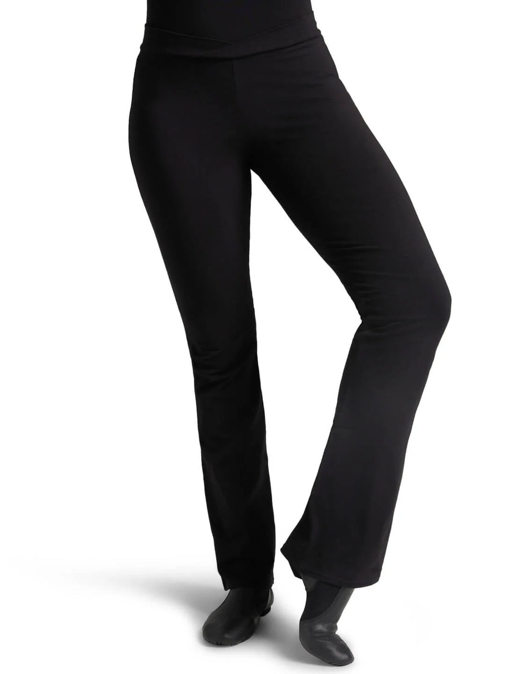 Front view of a dancer wearing black Capezio® Cotton V-Front Jazz Pants and jazz shoes, showing the flattering bootcut leg fit.
