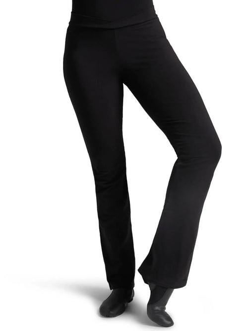 Front view of a dancer wearing black Capezio® Cotton V-Front Jazz Pants and jazz shoes, showing the flattering bootcut leg fit.