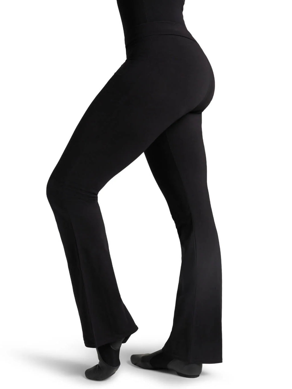 Side profile view of a fitness model wearing the black Capezio® CC750M jazz pants, showcasing the sleek lift and tailored hip-to-thigh compression.