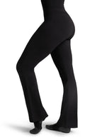 Side profile view of a fitness model wearing the black Capezio® CC750M jazz pants, showcasing the sleek lift and tailored hip-to-thigh compression.