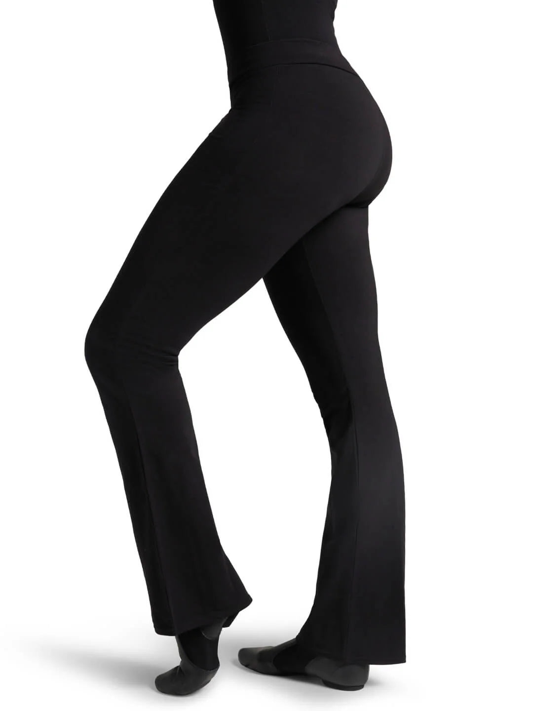 Side profile view of a fitness model wearing the black Capezio® CC750M jazz pants, showcasing the sleek lift and tailored hip-to-thigh compression.
