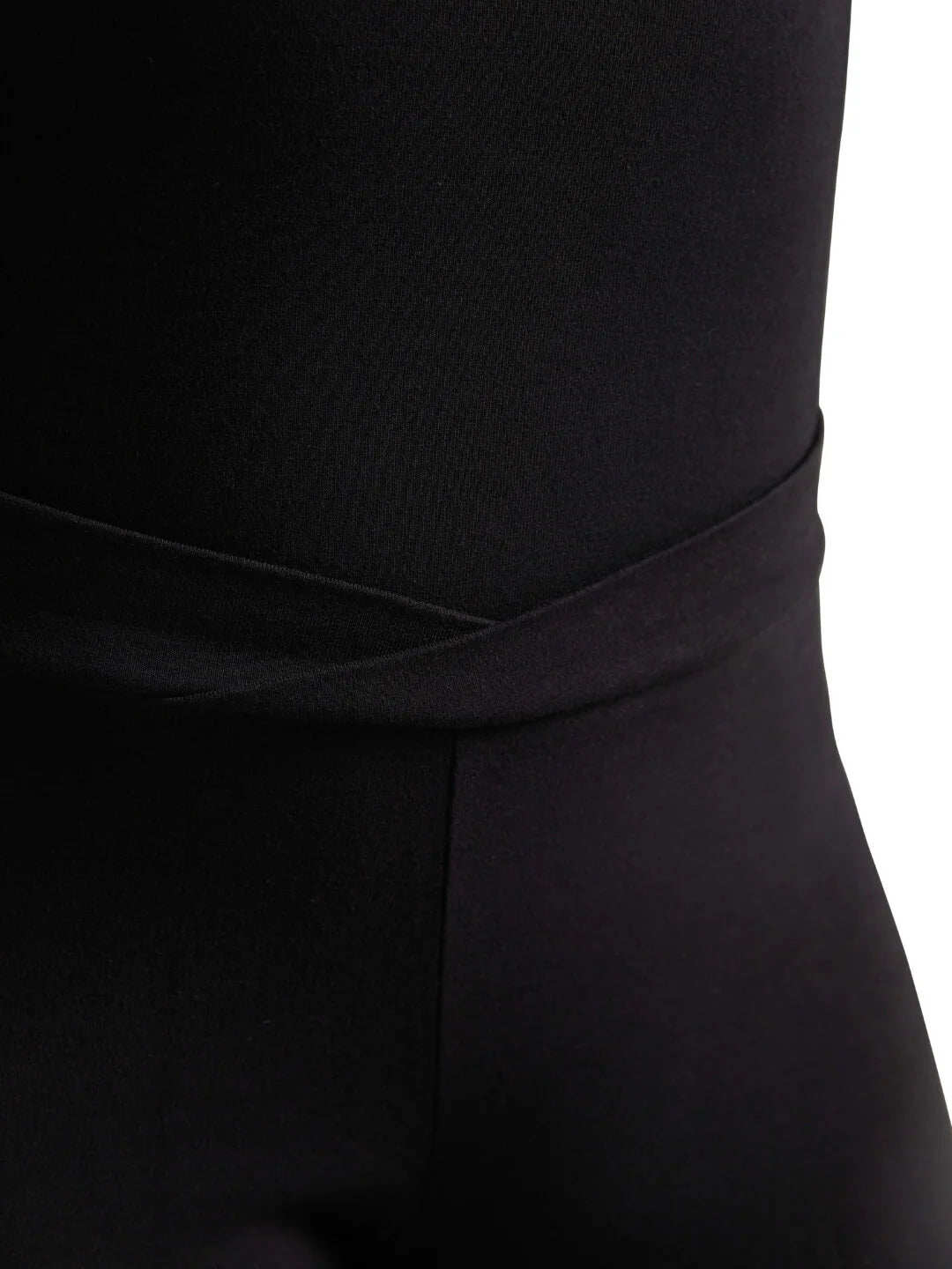 Close-up shot of the overlapping V-front waistband on the black Capezio® cotton dance pants, showcasing the cross-over style lines.