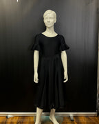 Detail of the Ellie juvenile practice skirt satin hemline in matt black Lycra.