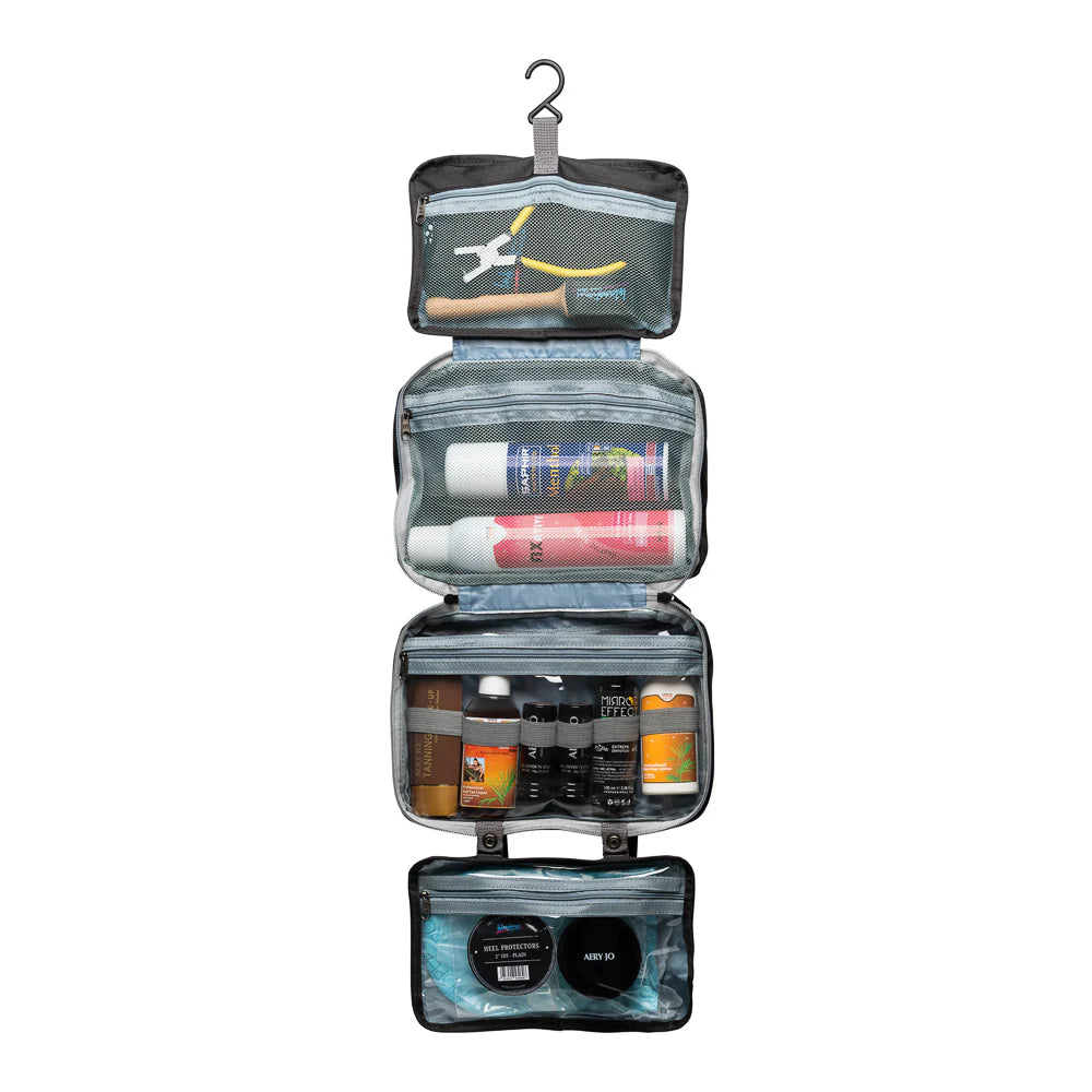 Black International Dance Shoes hanging Essentials Bag opened up to showcase four clear travel organizer compartments filled with dance cosmetics.