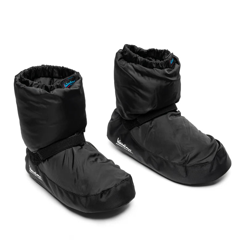 Pair of Black insulated Kids Warm Up Bootie by International Dance Shoes showing the cushioned upper, ankle strap, and signature brand logo tab.