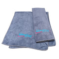 Gray International Dance Shoes microfiber performance towel featuring the iconic pink and blue embroidered IDS logo.