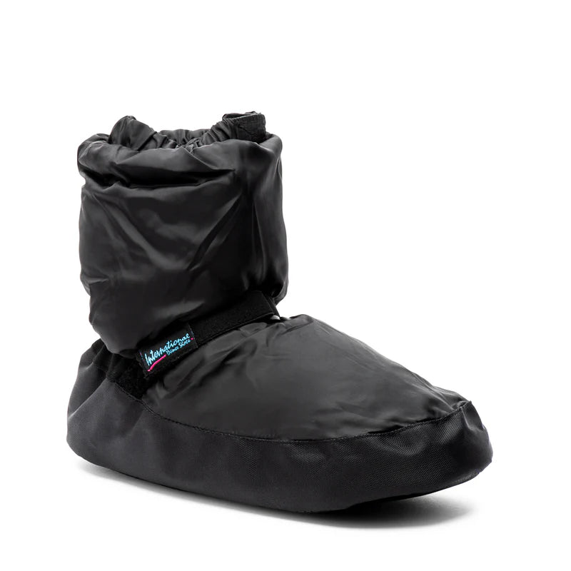 Black insulated Kids Warm Up Bootie by International Dance Shoes showing the cushioned upper, ankle strap, and signature brand logo tab.