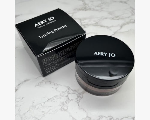 Aery Jo Tanning Powder with luxury black box packaging, professional three-dimensional pearl bronzing powder for competitive ballroom and Latin dancers.