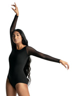 Front view of a female dancer wearing the Capezio® Meryl® Strappy Back Long Sleeve Leotard in black, featuring mesh long sleeves and a classic scoop neckline.