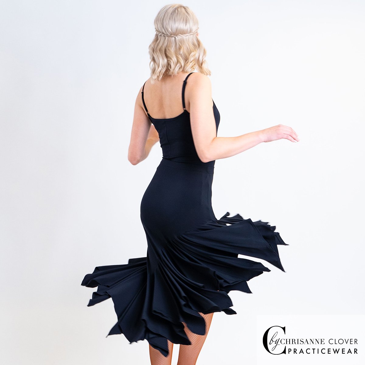 Lynx leotard and Comet Latin skirt in a turn