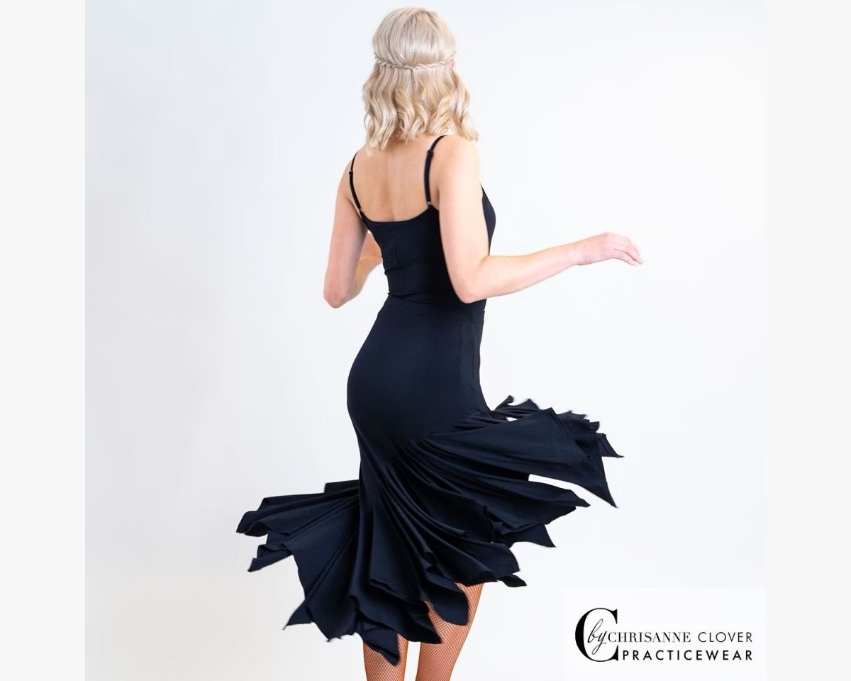 Chrisanne Clover Lynx dance leotard styled with a flowing black asymmetric Latin practice skirt, showing a complete professional training outfit.