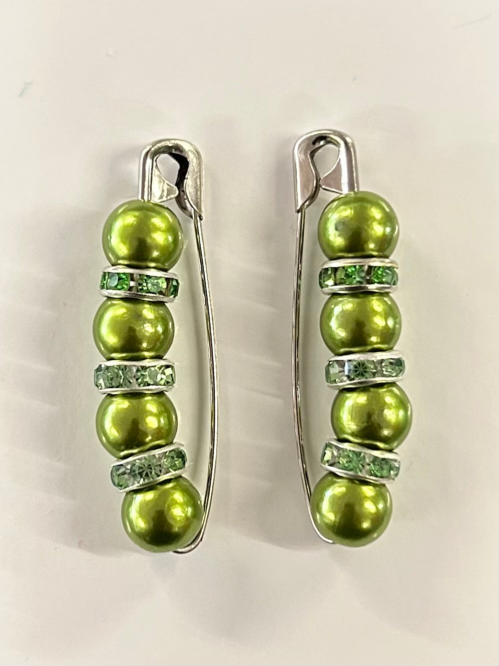 Crystal beaded competition number pins (pair) — green pearls with green crystal rondelles