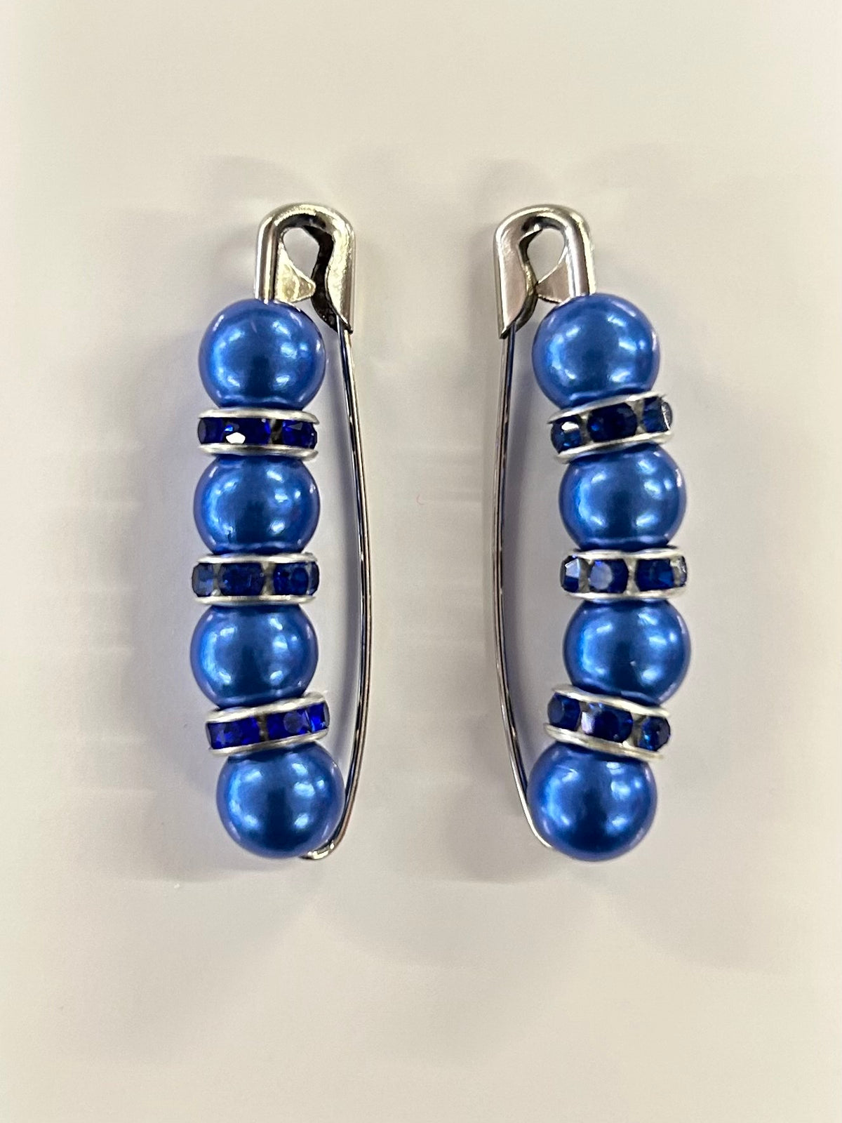 Crystal beaded competition number pins (pair) — royal blue pearls with blue crystal rondelles