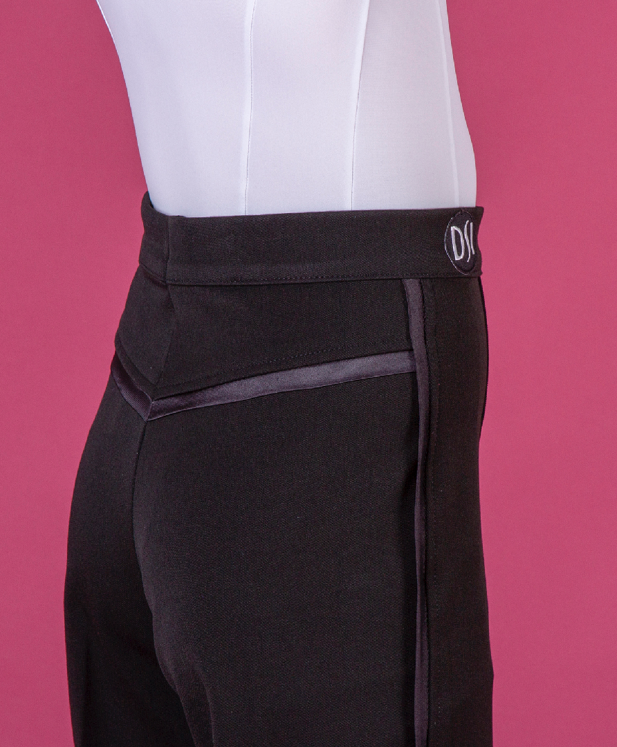 DSI London 1072 boys ballroom and Latin dance trousers in premium black gabardine, featuring a sleek narrow satin side stripe and tailored satin yoke.
