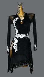 Black dress with white lace details on a mannequin against a gray background