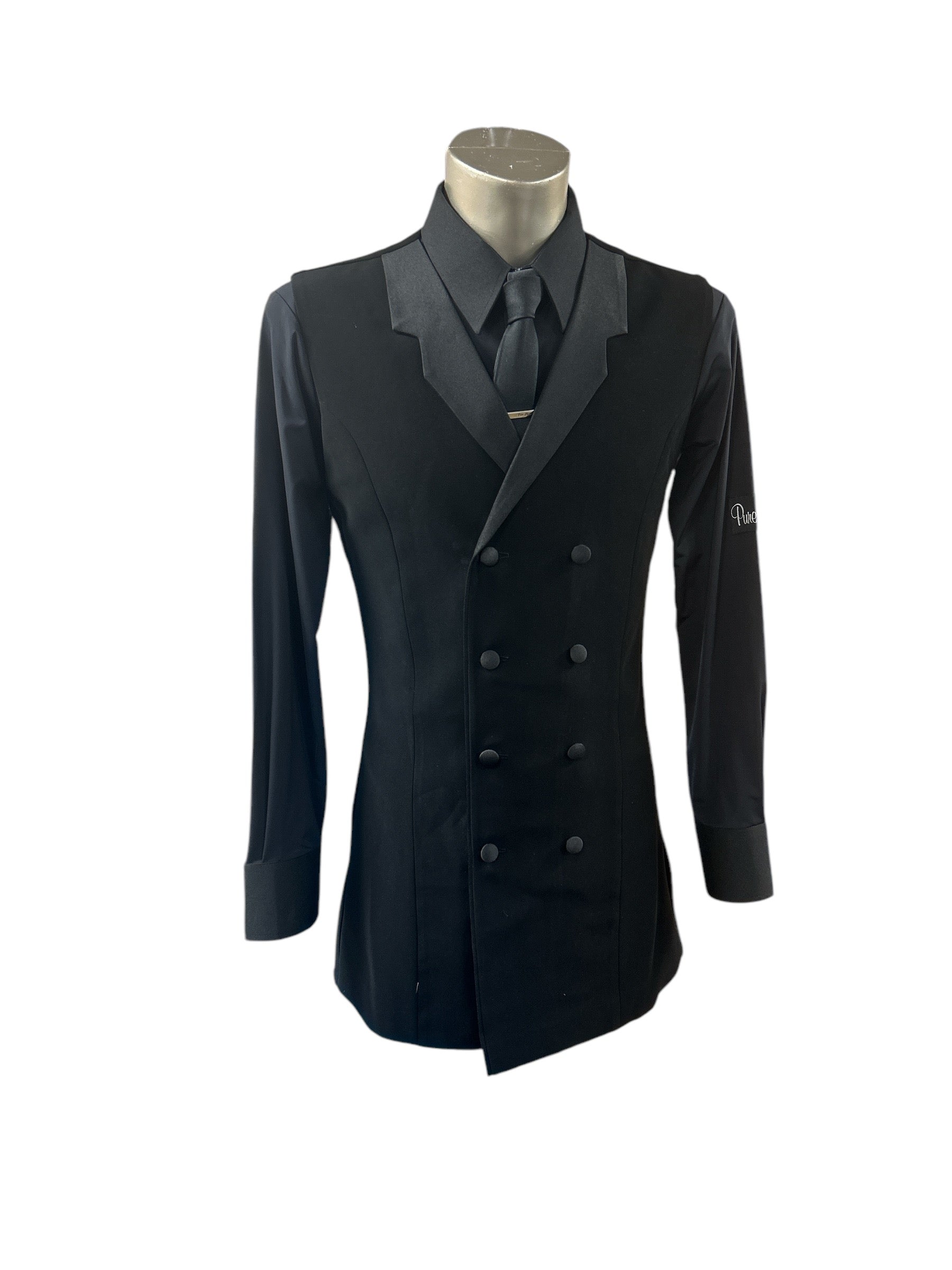 Pure Class longline sleeveless stretch jacket in black double breasted style layered over a black collared dance shirt on a studio mannequin.
